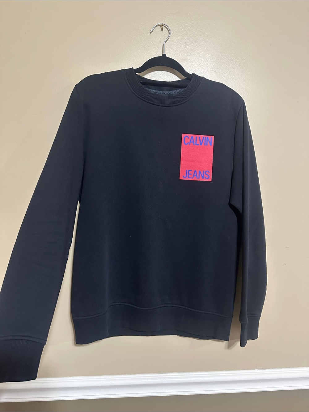 Calvin Klein Jeans Black Crewneck Sweatshirt with Red Logo Patch